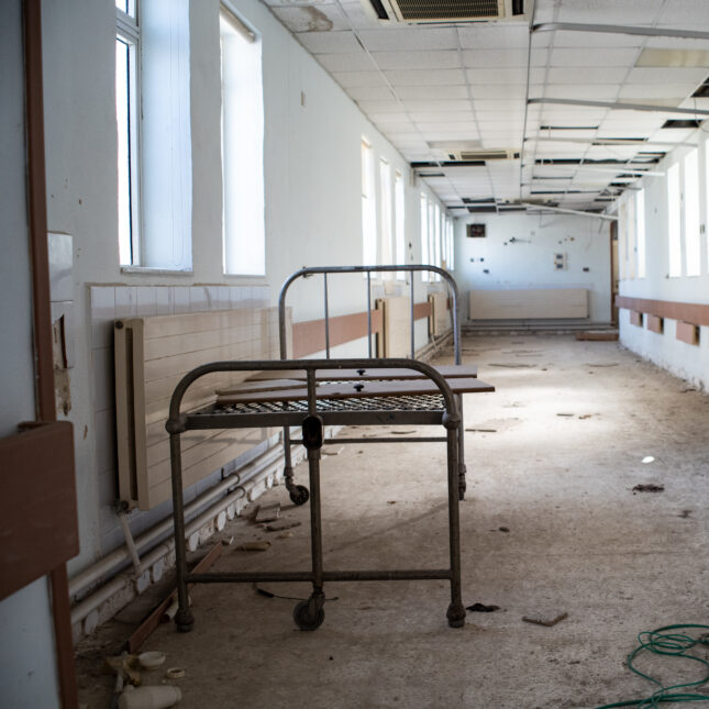 The structure of a hospital bed at the abandoned, empty aisle of St Luke's Hospital