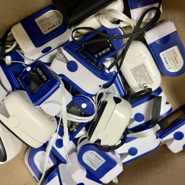 Box of pulse oximeters -- health equity coverage from STAT