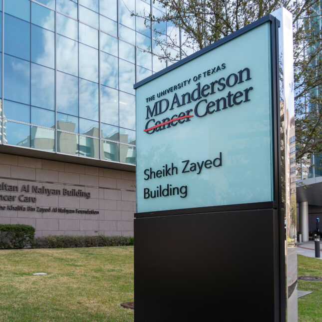 The sign of University of Texas MD Anderson Cancer Center in Houston, Texas in front of the Sheikh Zayed Building — coverage from STAT