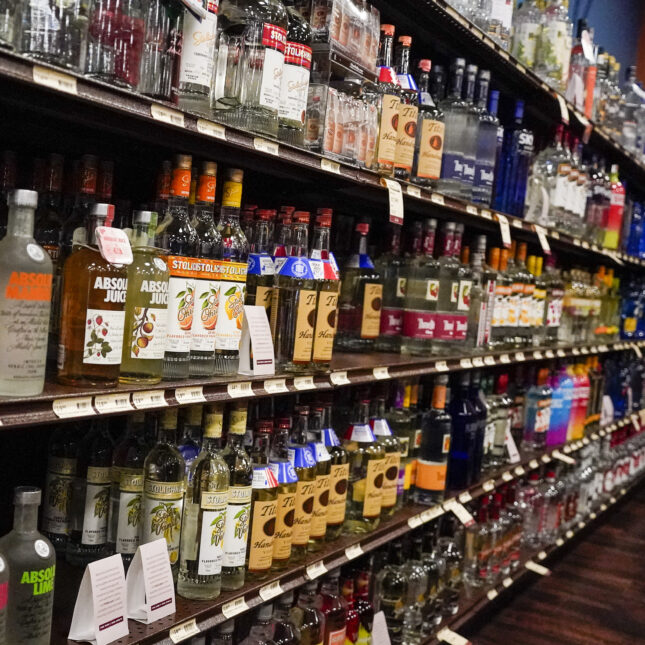 Bottles of liquors were displayed a shelf of five tiers — first opinion coverage from STAT
