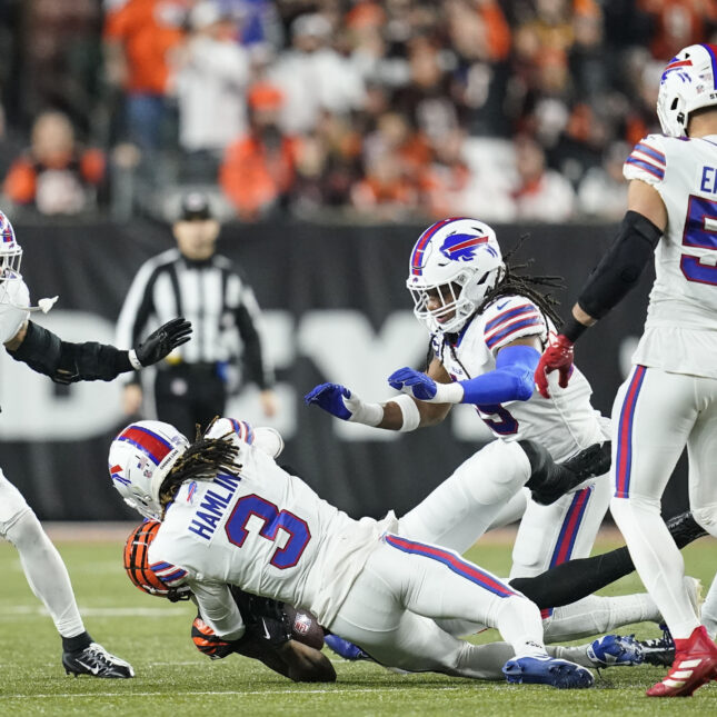 FILE - Cincinnati Bengals wide receiver Tee Higgins (85) collides with Buffalo Bills safety Damar Hamlin (3) during the first half of an NFL football game. -- first opinion coverage from STAT