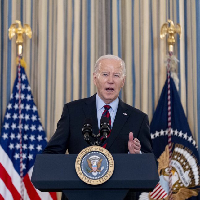 President Joe Biden speaks and gestures with one hand at a podium — breaking news coverage from STAT