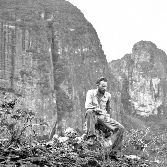 Richard Evans Schultes sits on a rock in the Cerro Campana mountains