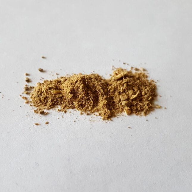 Powdered ibogaine against a white background.