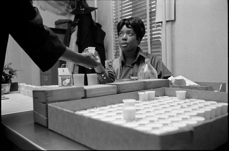 A nurse hands a cup of methadone to a man in a medical clinic in Washington DC in 1971