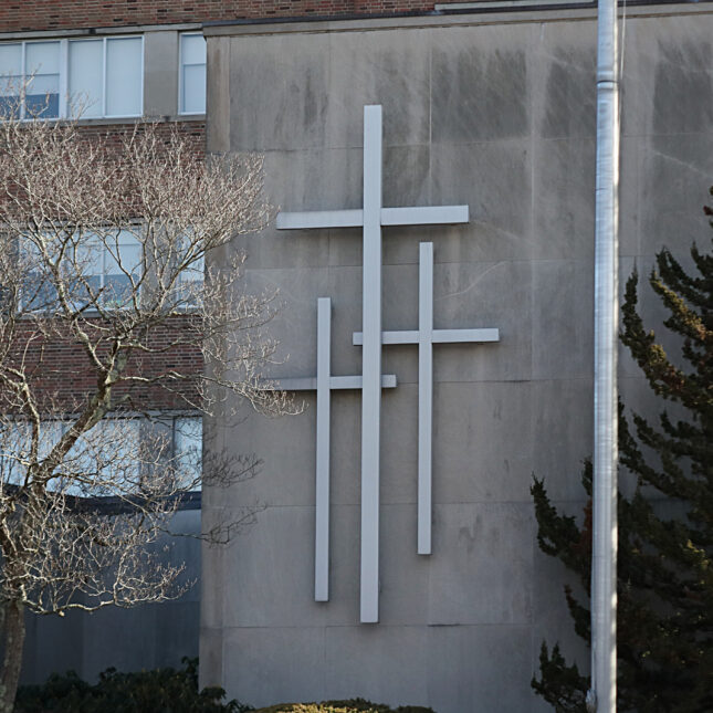 The exterior of Good Samaritan Medical Center embellished with three crosses — hospitals coverage from STAT
