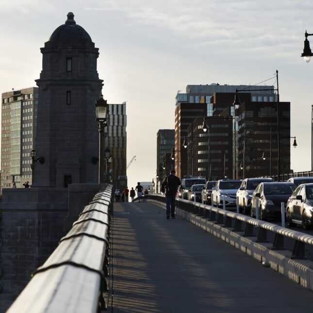 Traffic on the Longfellow Bridge and the Kendall Square skyline are seen. -- health coverage from STAT